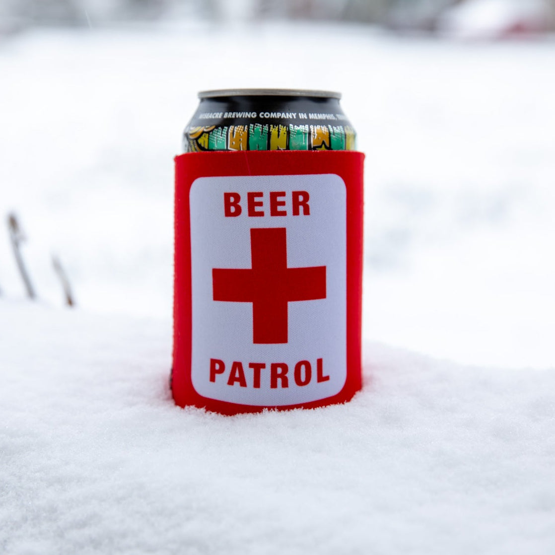 Can cooler with 'Beer Patrol' label in the snow